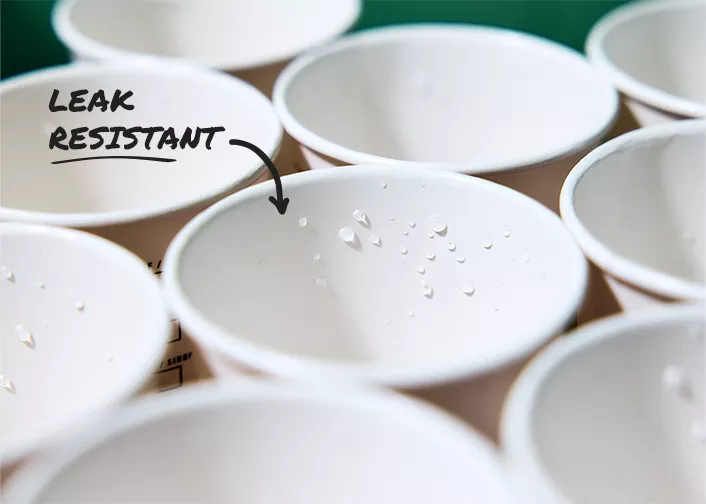 Water droplets sitting on surface of cup
