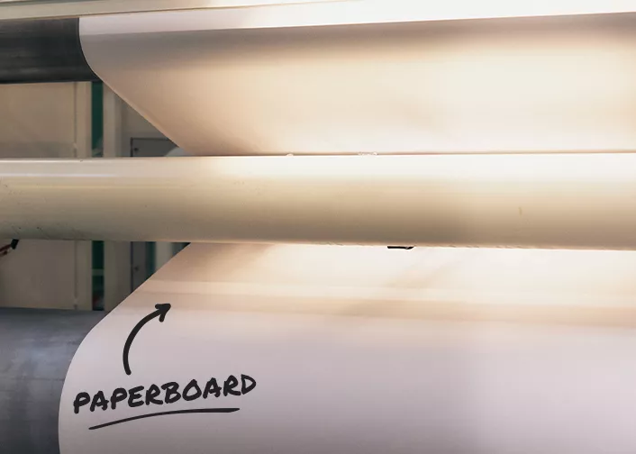 Sheet of paperboard on a roller